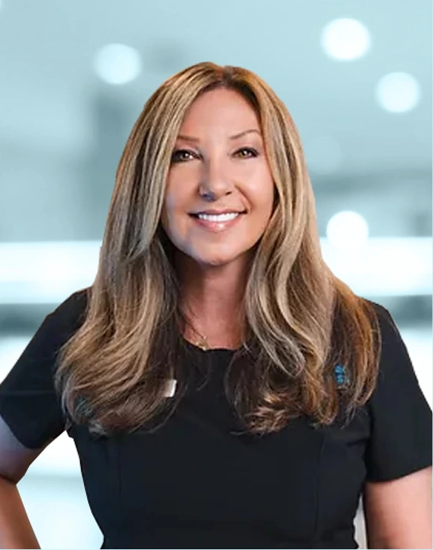 Christine Jinks, woman with long brown hair smiling in black top