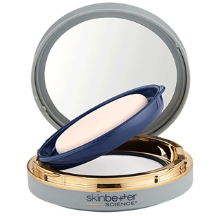 SkinBetter Science powder compact with mirrored lid, blue applicator, and gold-tone ring