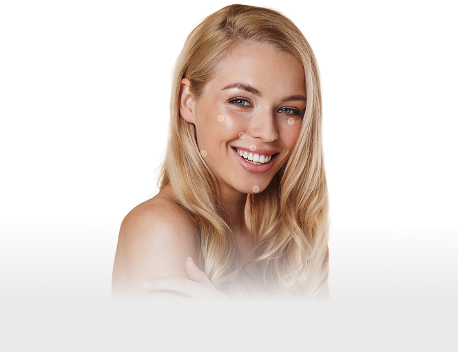 Smiling woman with blonde hair and glowing skin showcasing filler results