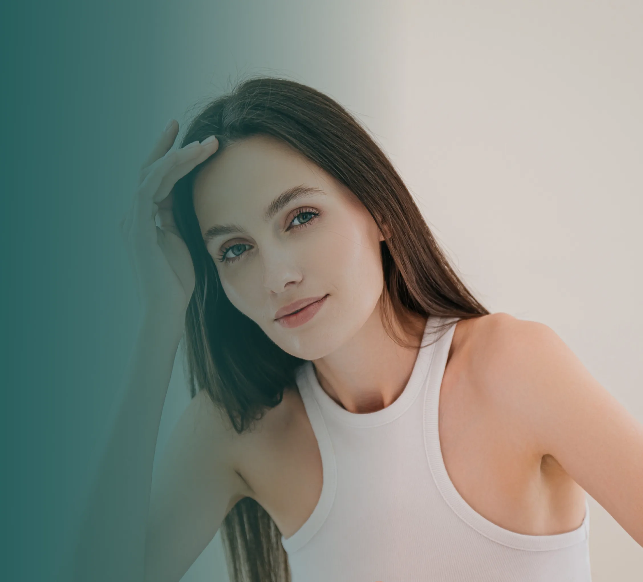 Woman with smooth skin touching her hair, wearing a white tank top against a teal-to-white gradient background