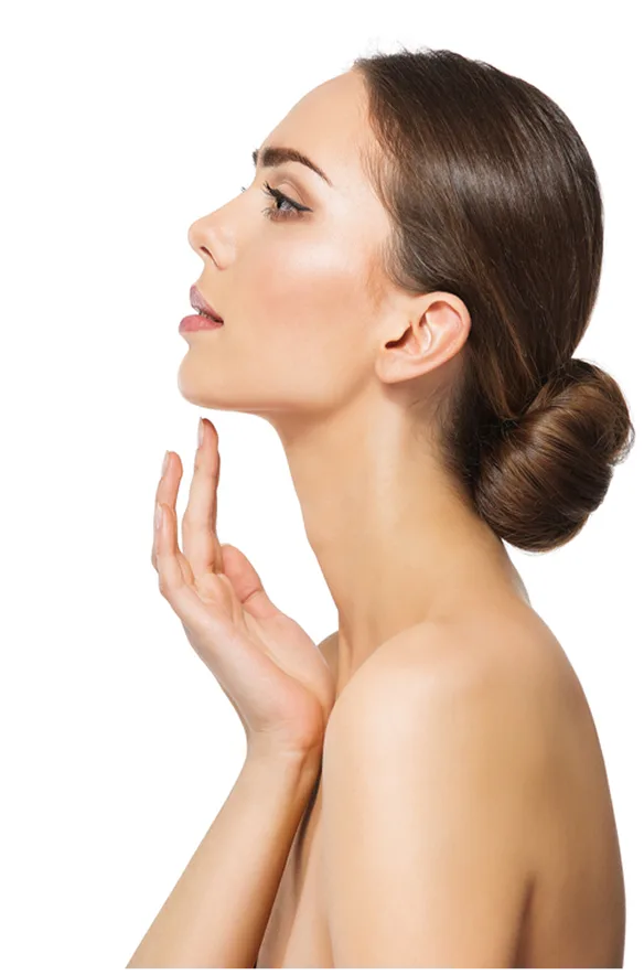 Woman in profile with hand near chin and jawline, hair in low bun