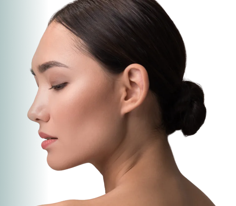 Woman in profile with neutral gradient background