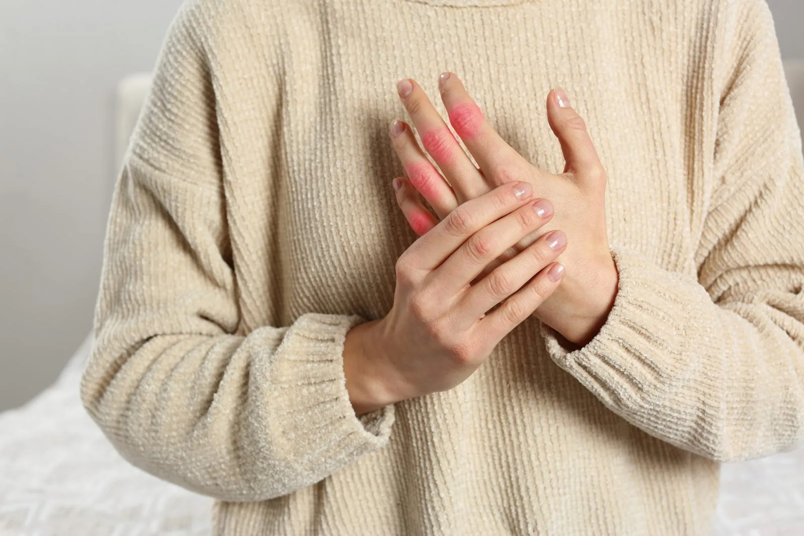 Patient holding a painful hand joint