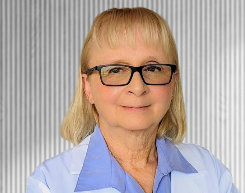 Cindy, healthcare provider wearing glasses and light blue medical uniform