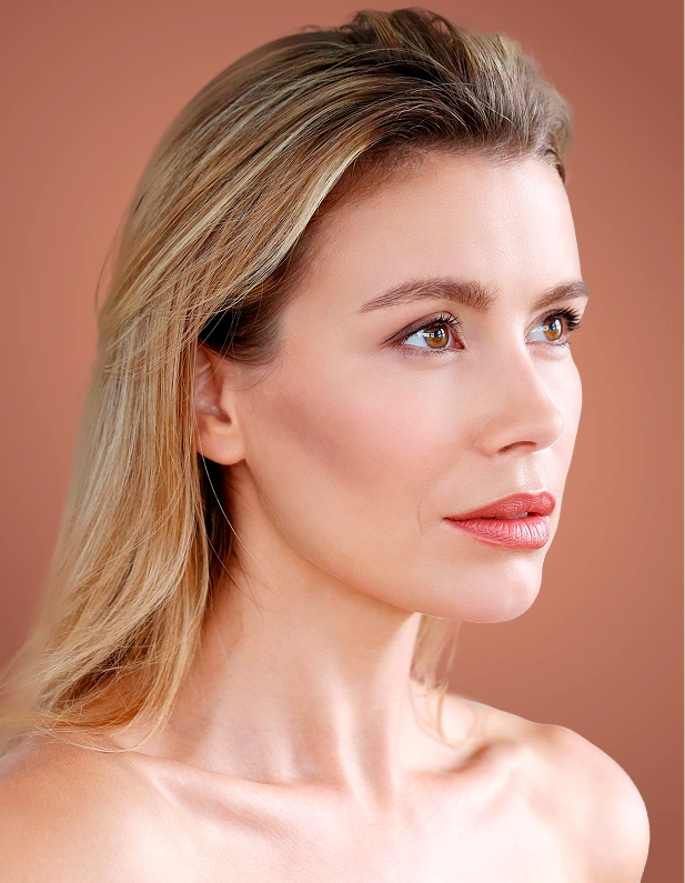 Woman in profile displaying smooth skin and defined facial features