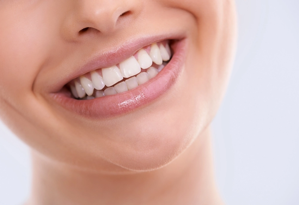 Woman smiling showing bright, white teeth