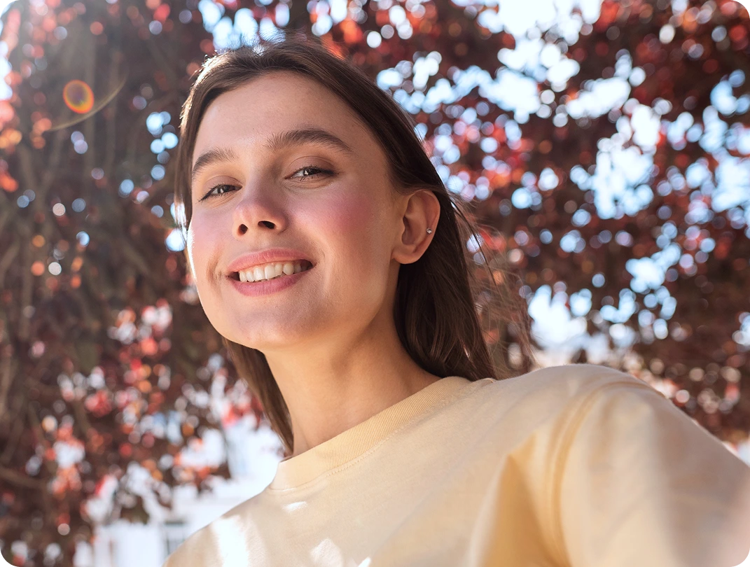Smiling young woman outdoors