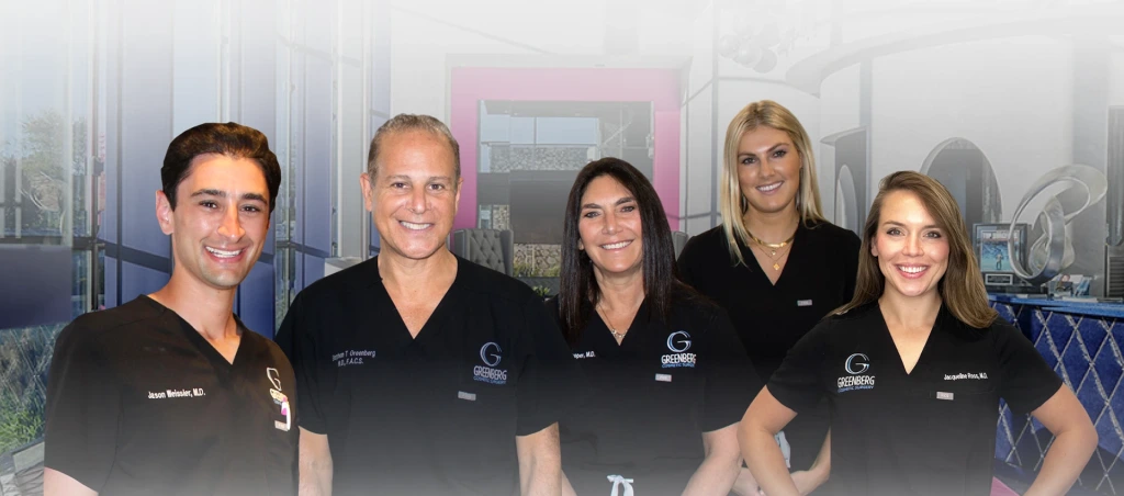 Five cosmetic surgery team members in black scrubs standing in front of a city skyline backdrop