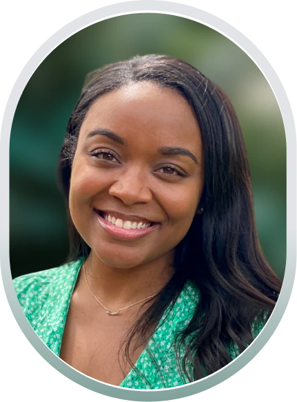 Kayla Waller, LCSW, smiling in a gray oval-framed portrait wearing a green patterned top