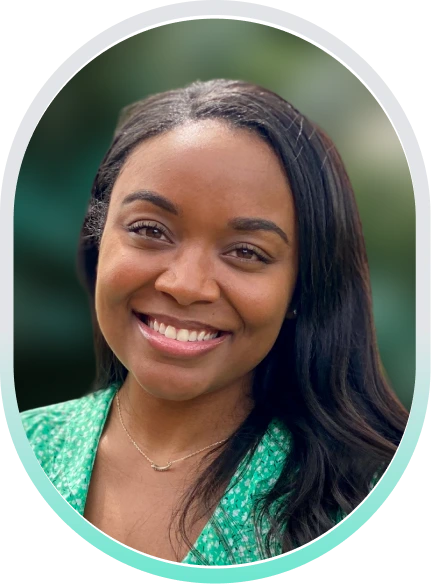 Kayla Waller, LCSW, smiling in a teal oval-framed portrait wearing a green patterned top
