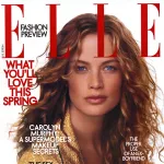 ELLE magazine cover featuring woman with wavy hair and red ribbon accent