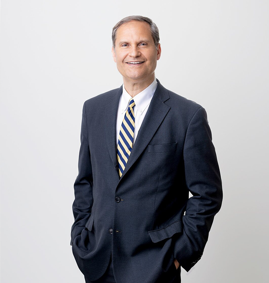 Dr. Joseph F. Capella in professional portrait wearing dark suit and blue striped tie