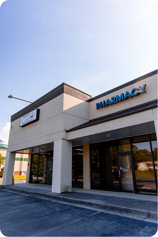 Cherokee Custom Pharmacy storefront with blue signage and large windows