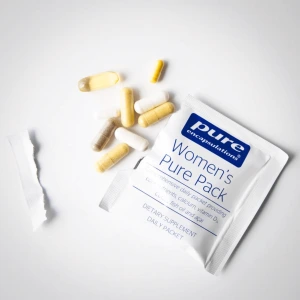 Pure Encapsulations Women's Pure Pack daily packet surrounded by yellow and white capsules