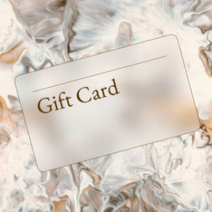 Gift card placed on marble and gold textured surface
