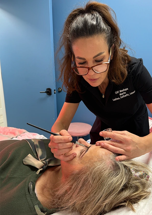CNT MedSpa aesthetician performing brow lamination on client's eyebrows