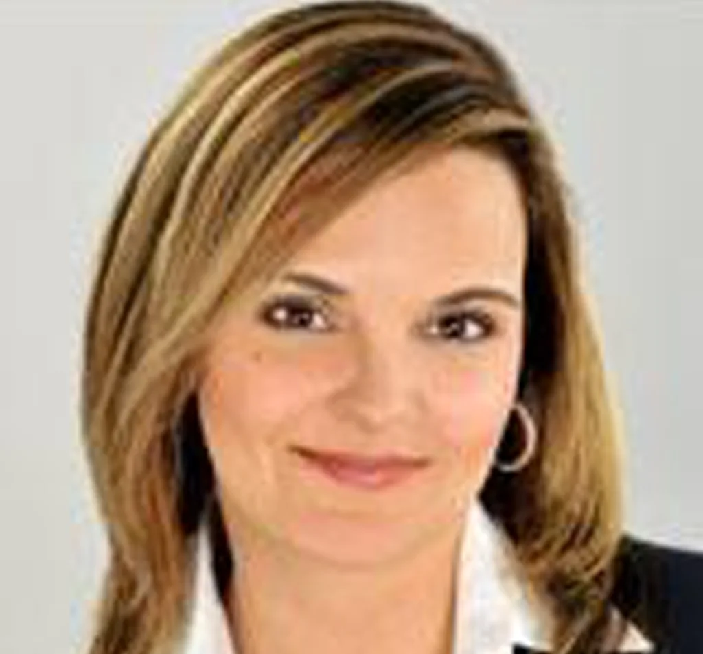 Dr. Sickinger, woman with shoulder-length blonde hair wearing professional attire