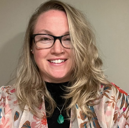Haley Mozonski, team member at Contemporary Care, smiling in professional photo wearing patterned jacket