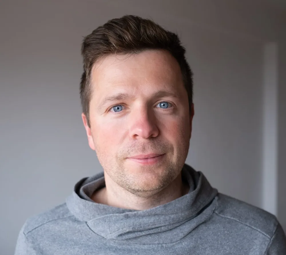 Calm man in a gray hoodie