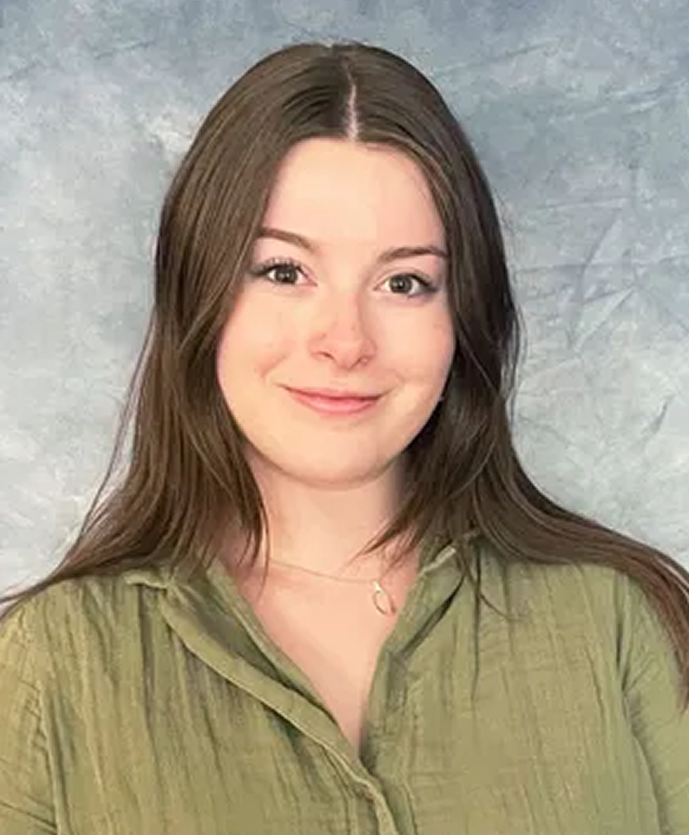 Sarah, a counselor at Daybreak Counseling Center, in a professional headshot wearing an olive green shirt