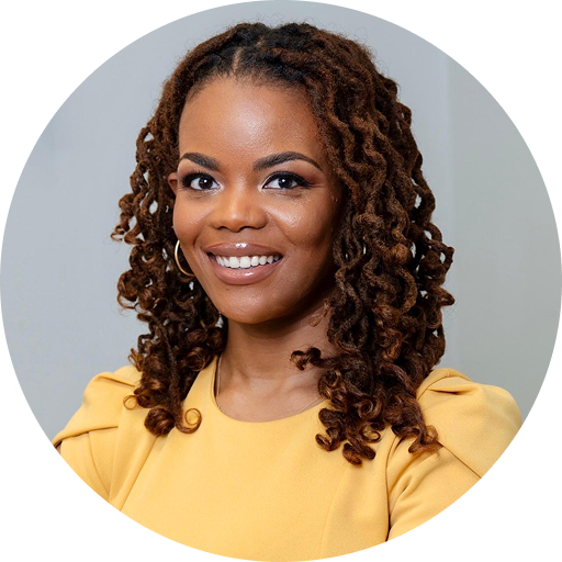 Smiling woman with brown braided hair wearing a yellow top, circular headshot portrait