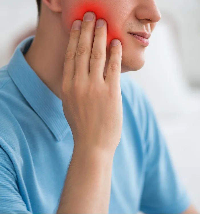 Person holding jaw with red pain indicator showing jaw discomfort
