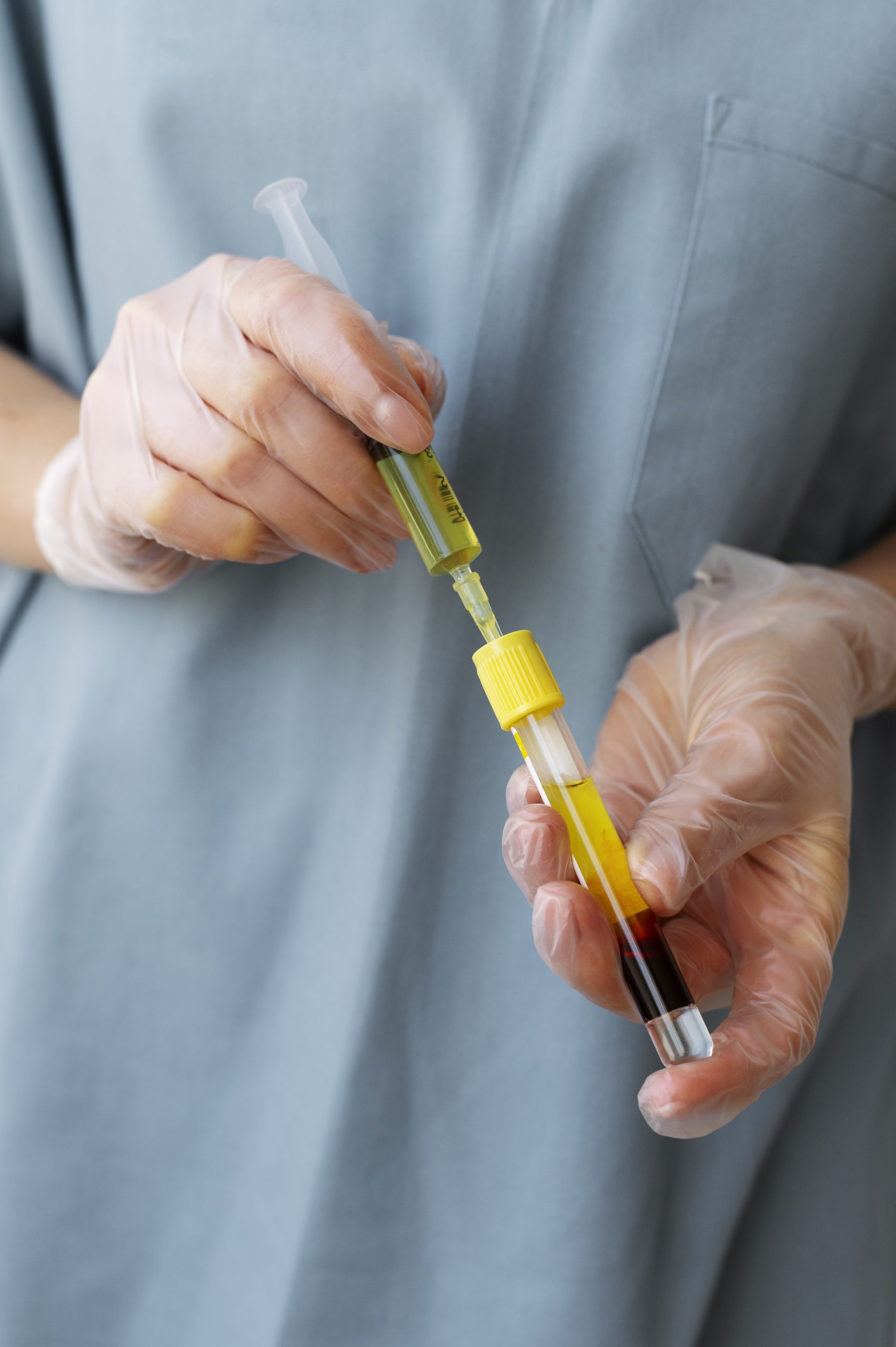 front view healthcare professional holding vial injection