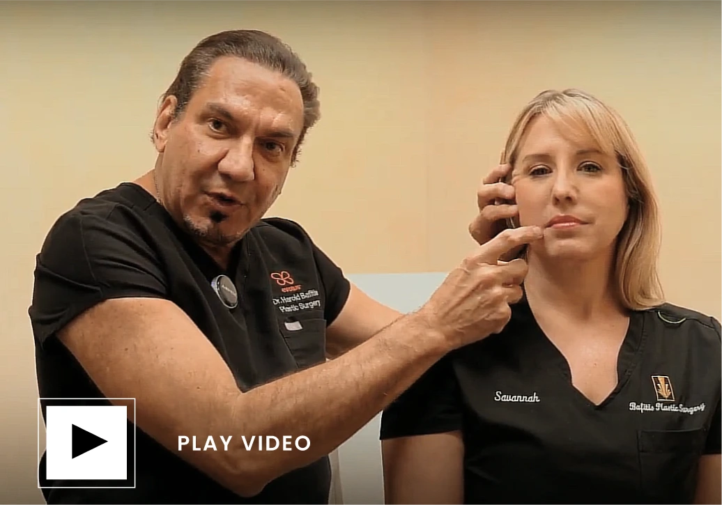 Plastic surgeon examining patient's face during consultation, play video