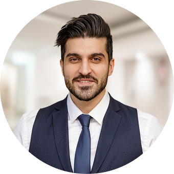 Man in navy blazer and blue tie, professional portrait