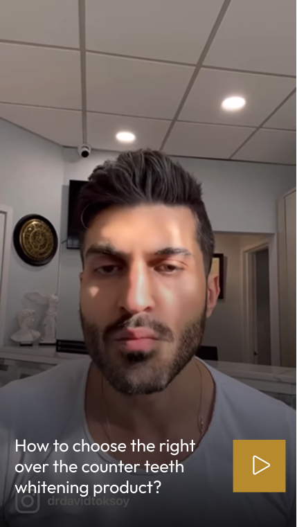 Man in dental office discussing how to choose the right over-the-counter teeth whitening product