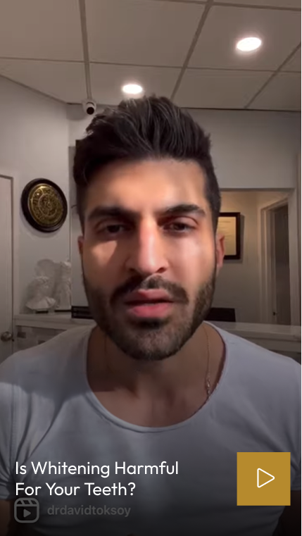 Man in dental office addressing whether teeth whitening is harmful