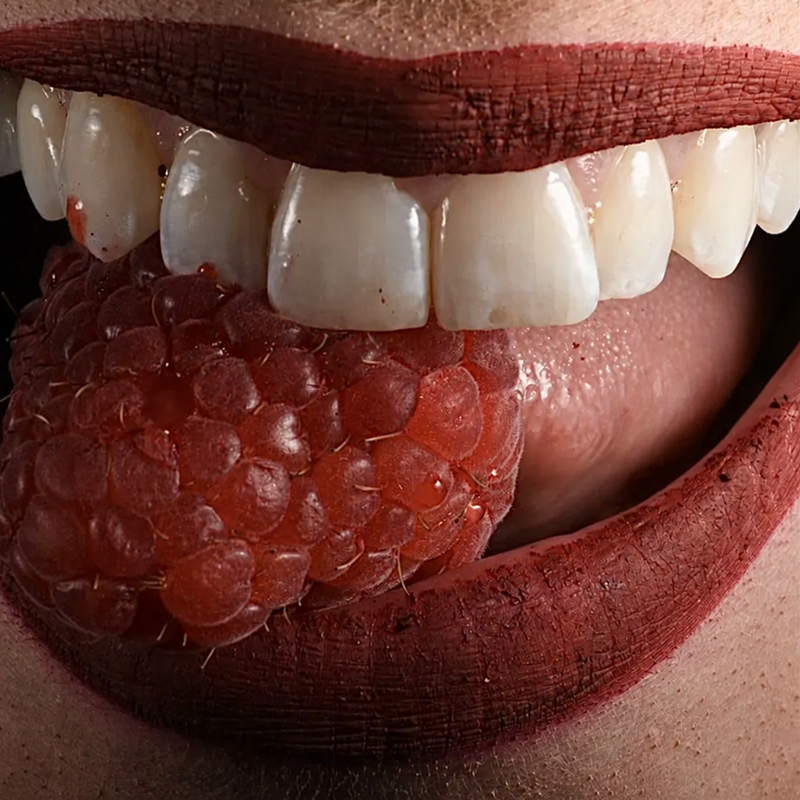 Close-up of white teeth with visible staining from dark-colored berries