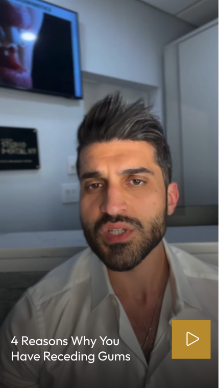 Man in dental office explaining four reasons why you have receding gums