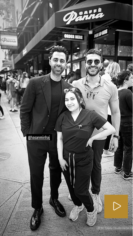 Black and white photo of three people posing together outside Super Panna storefront