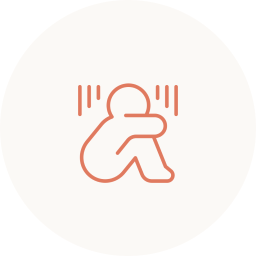Seated figure with hands to head and vertical lines showing emotional distress