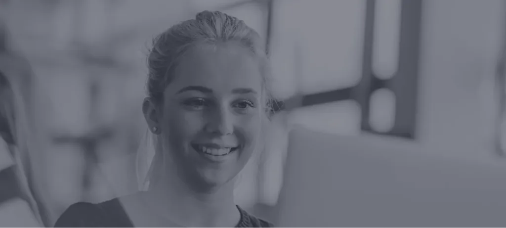 Young woman smiling at camera in bright indoor space