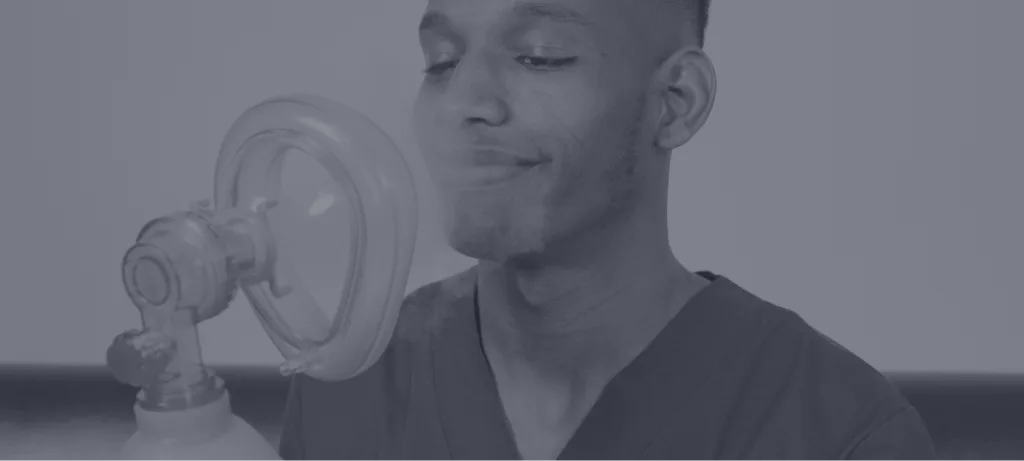 Man holding nitrous oxide mask near his face