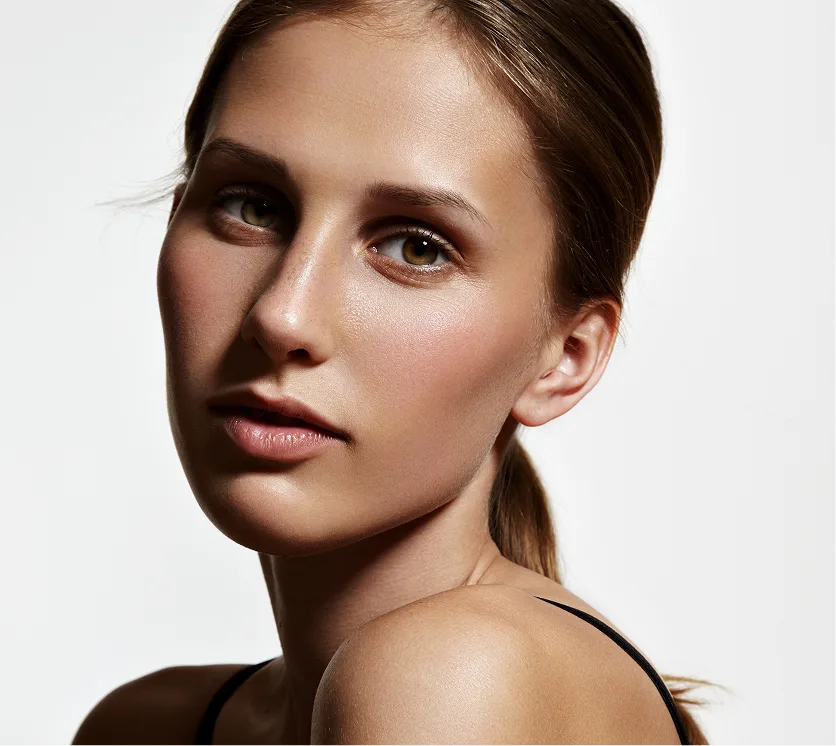 Woman's face in three-quarter view showing smooth skin and facial features