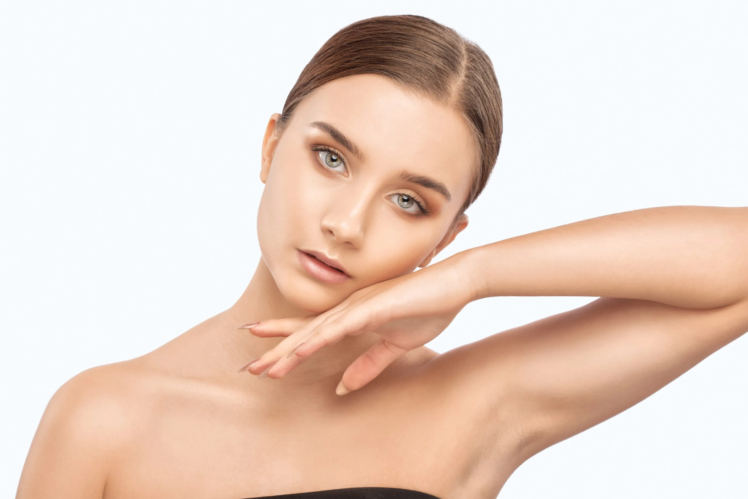 Woman with smooth skin on shoulder and arm after laser hair removal treatment