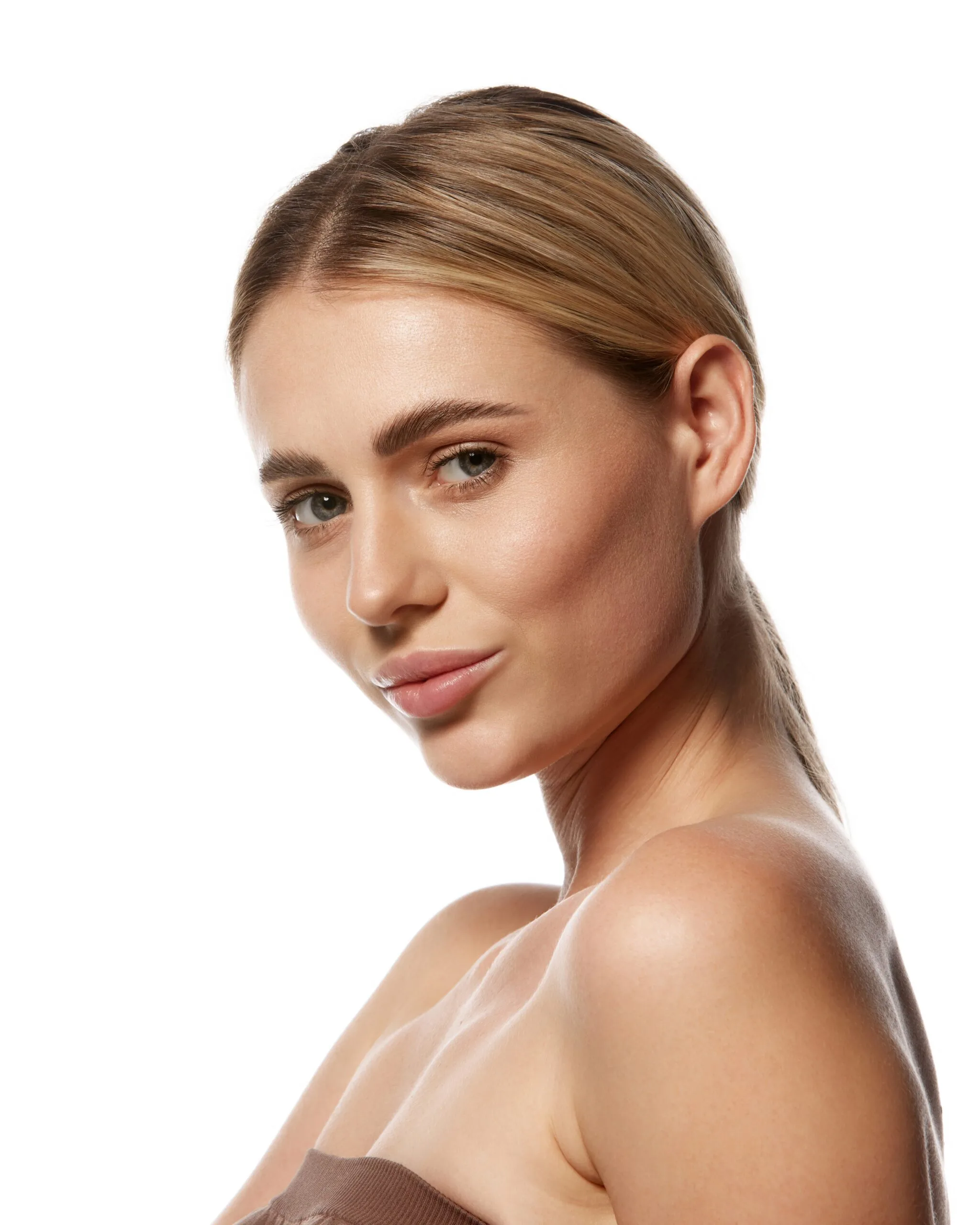 Woman with clear skin showing results of photodynamic therapy treatment