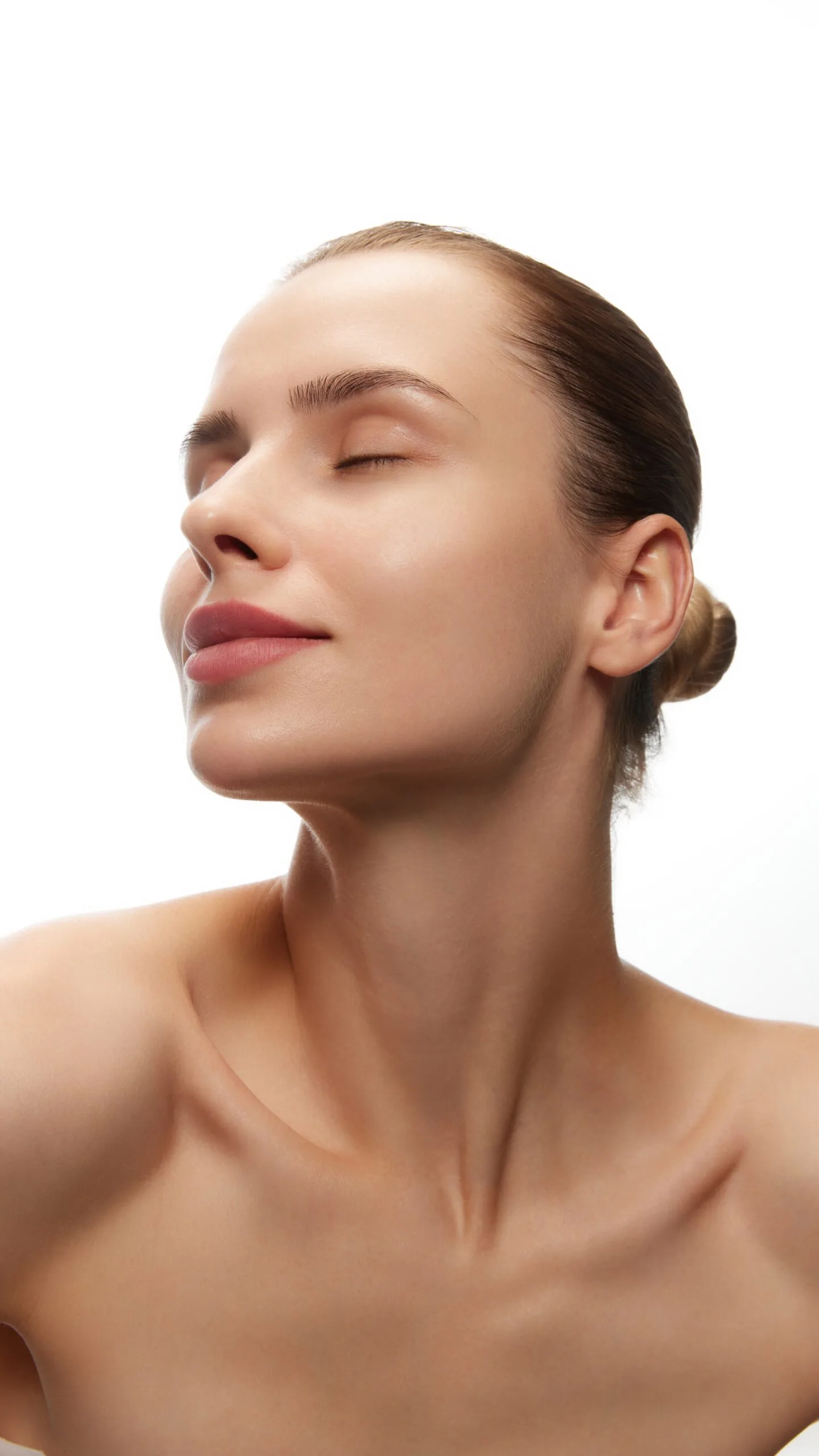 Woman with smooth, glowing skin shown in profile after skin resurfacing treatment