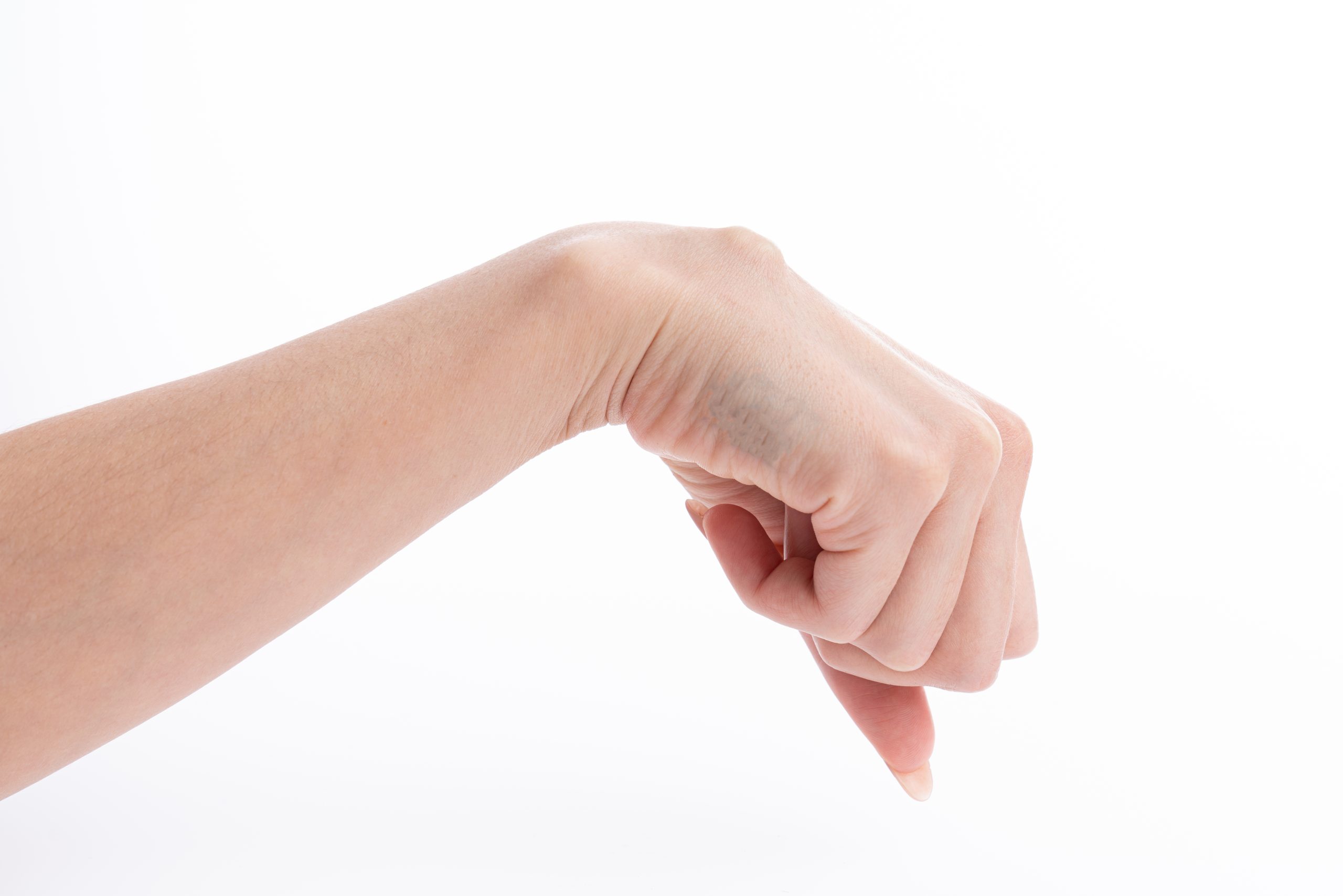 Hand with thumb pointing downward