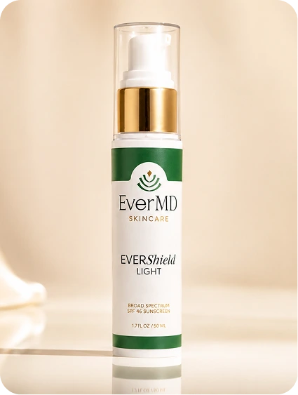 EverMD EVERShield Light broad spectrum SPF 48 sunscreen bottle with white pump and gold band