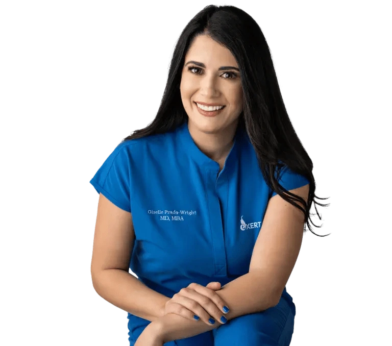 Giselle Prada-Wright, MD, MBA in blue Exert clinic uniform