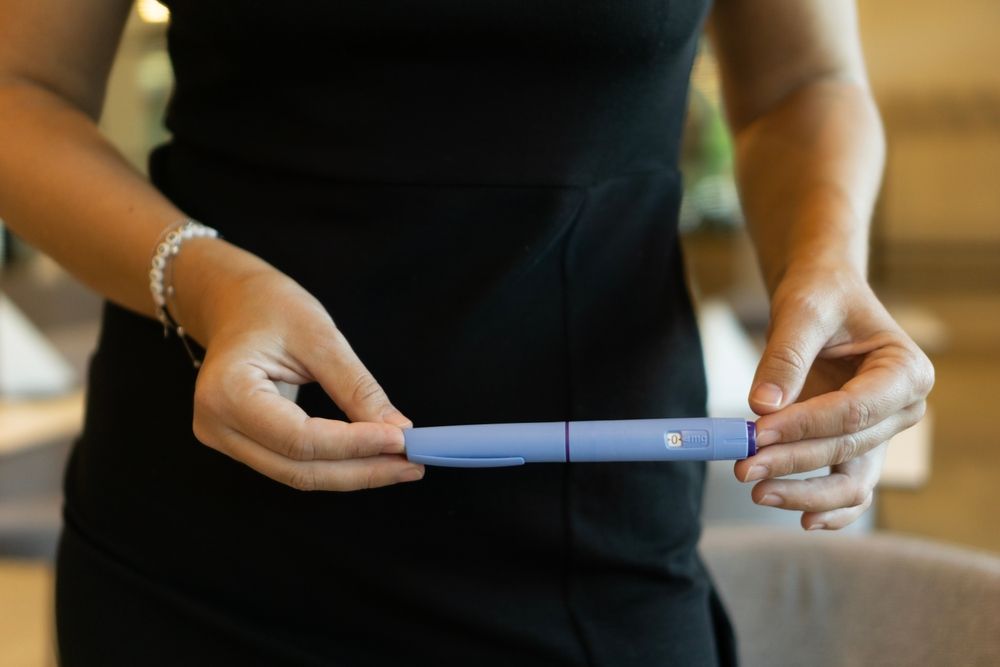 Woman holding a positive pregnancy test result