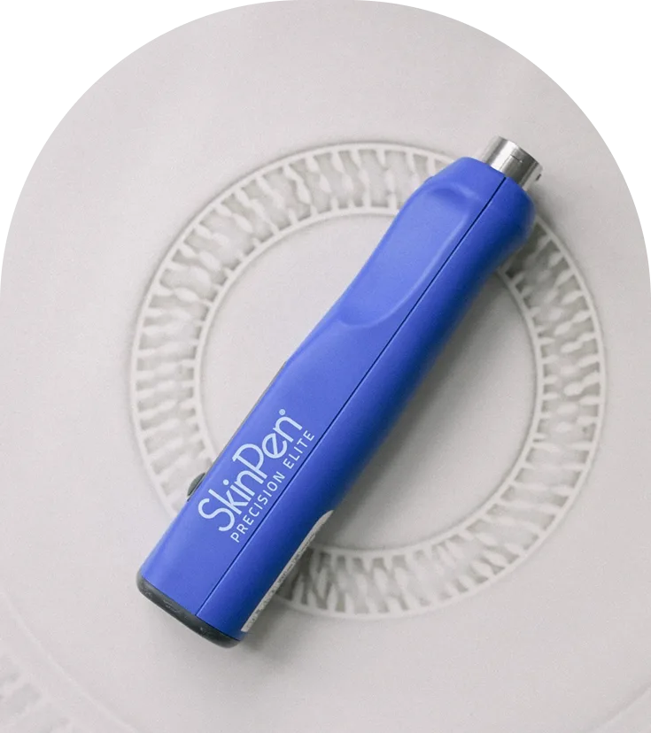 Blue Skinpen Precision handheld microneedling device displayed on textured surface