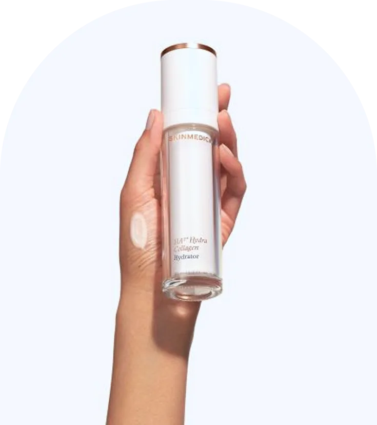 Hand holding SkinMedica HydraColl Collagen Hydrator serum bottle