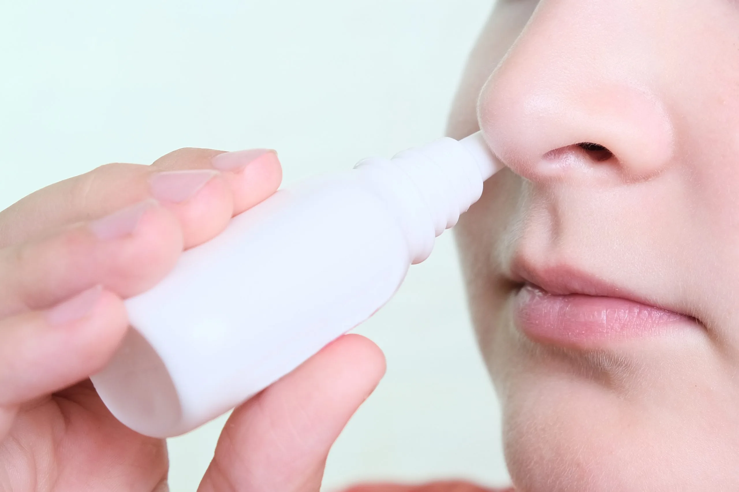 A,boy,with,a,runny,nose,holds,a,medicine,in