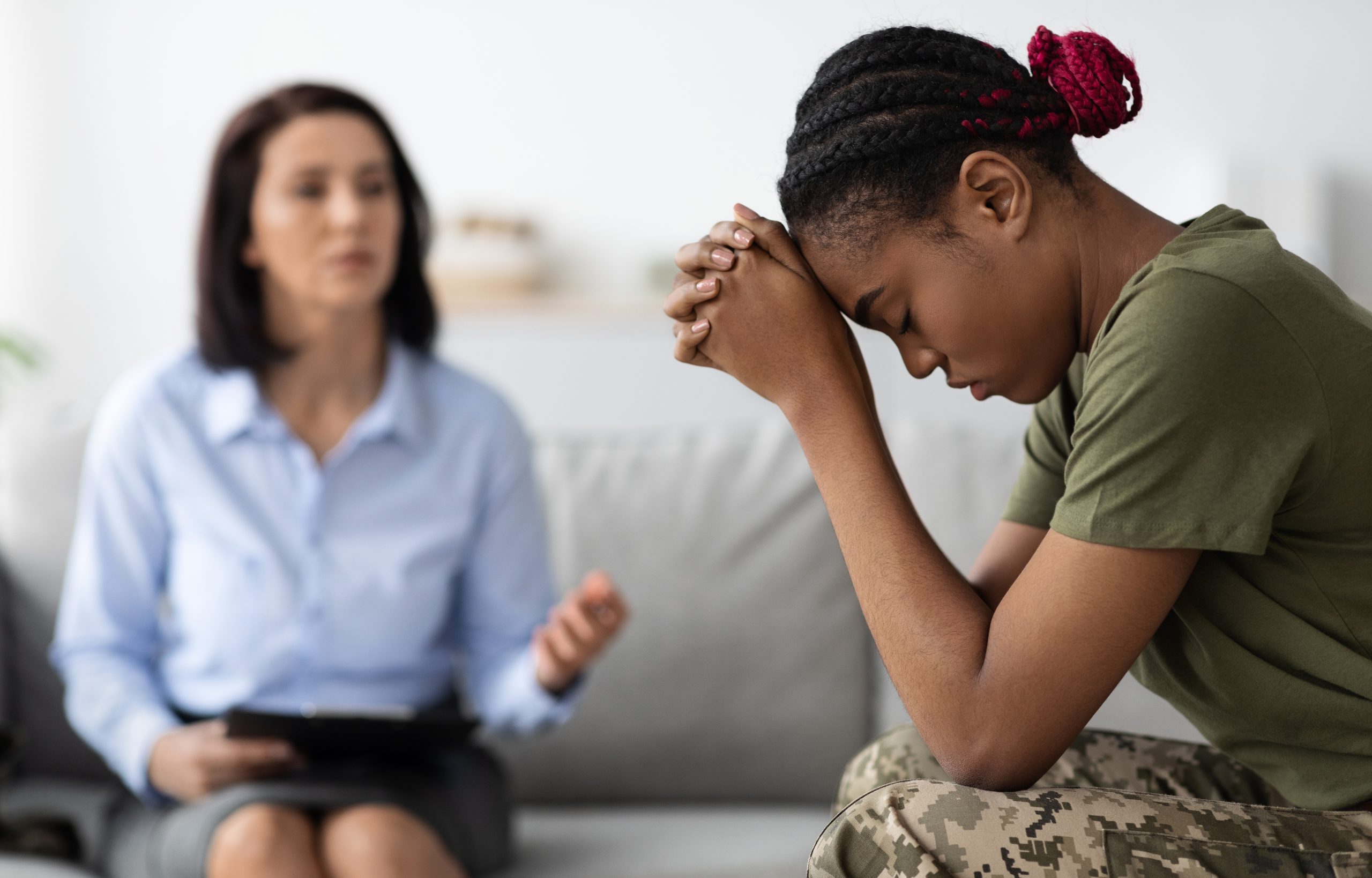 Posttraumaticstressdisorder Depressedblacksoldierwomanattendingtherapysession