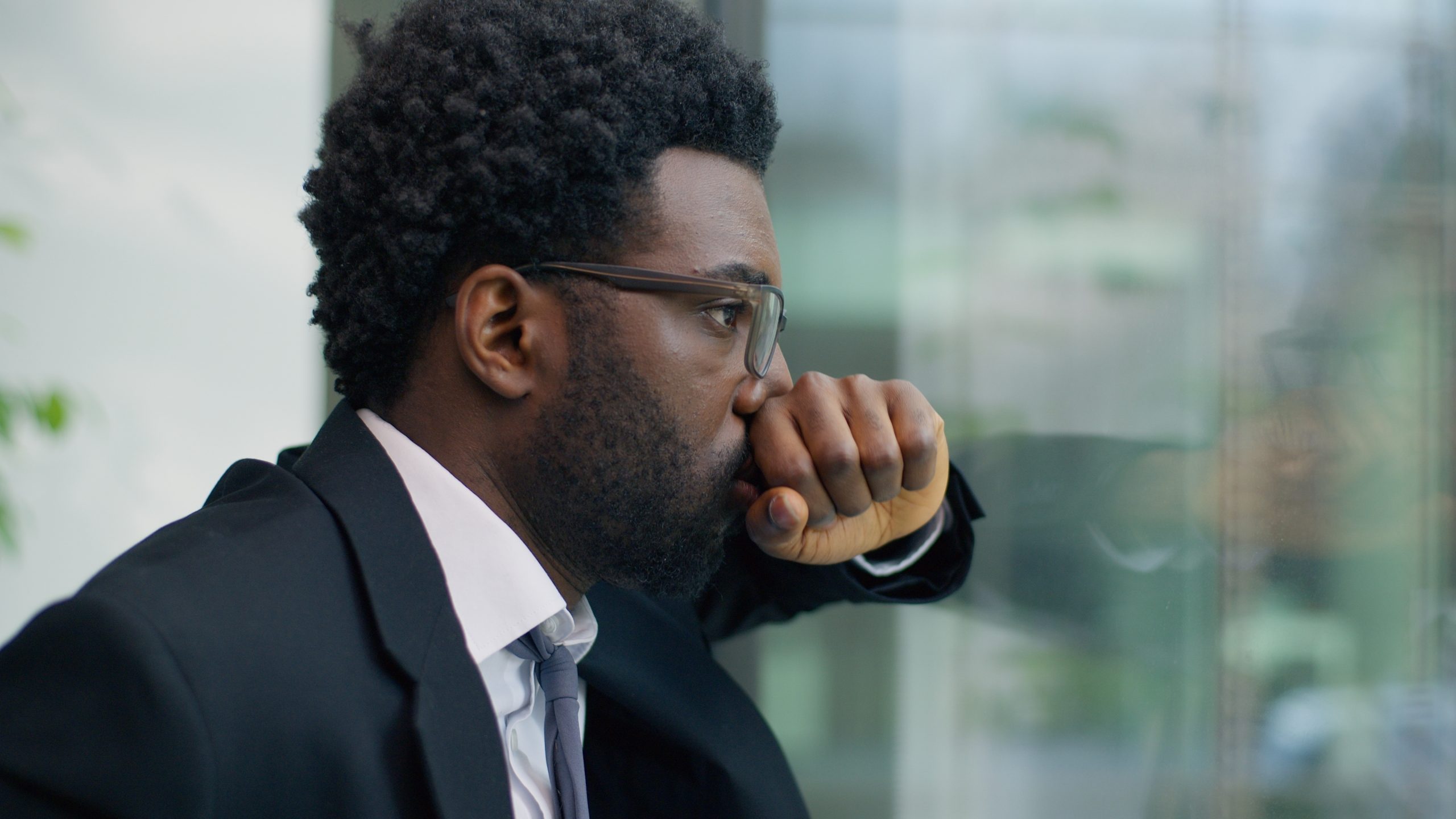 Sufferingafricanamericanmanbusinessguymalebusinessmanstressedoverworked